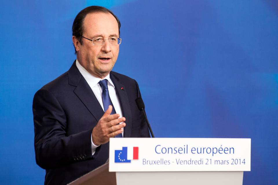 French President Francois Hollande addresses the media at the end of an EU summit in Brussels on Friday, March 21, 2014. Ukraine’s prime minister has pulled his nation closer into Europe’s orbit, signing a political association agreement with the EU at a summit of the bloc’s leaders. Friday’s agreement between Prime Minister Arseniy Yatsenyuk and the EU leaders was part of the pact that former President Viktor Yanukovych backed out of last November in favor of a $15 billion bailout from Russia. That decision sparked the protests that ultimately led to his downfall and flight last month, setting off one of Europe’s worst political crises since the Cold War. (AP Photo/Geert Vanden Wijngaert)