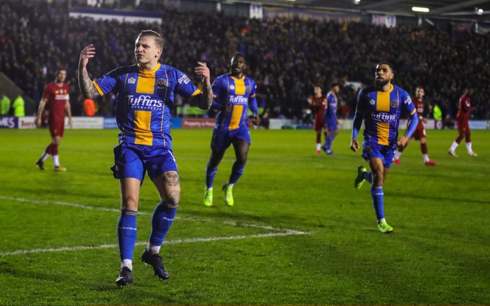 Jason Cummings of Shrewsbury Town celebrates after scoring a goal to make it 1-2 during the FA Cup Fourth Round match between Shrewsbury Town and Liverpool  - Getty Images Europe