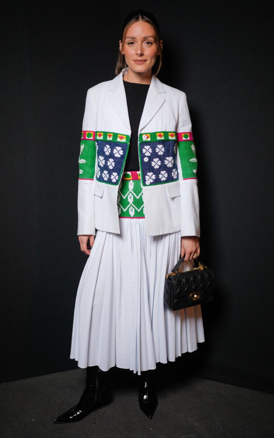 Olivia Palermo wears an indigenously inspired skirt suit from Dior at the Paris Fashion Week show in February