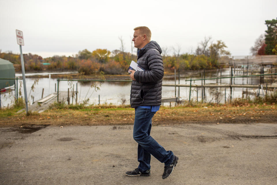 Andrew Myers, Republican candidate for the Minnesota House of Representatives District 45A, goes door-knocking along the eastern bank of Lake Minnetonka in Excelsior, Minn. (AP Photo/Nicole Neri)