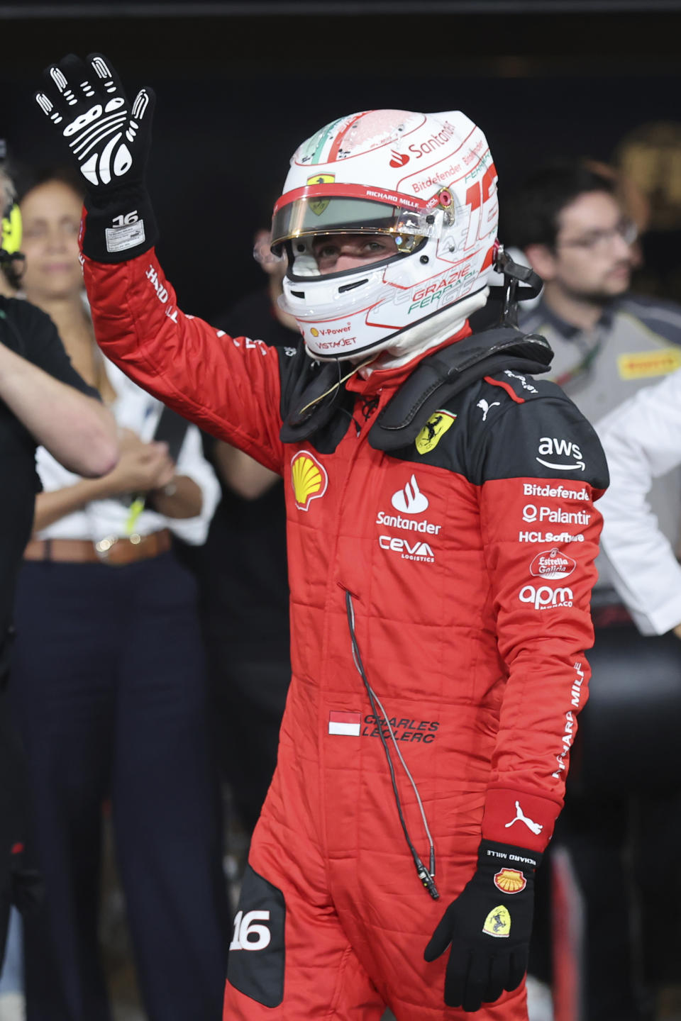 Ferrari driver Charles Leclerc of Monaco waves after qualifying session ahead of the Abu Dhabi Formula One Grand Prix at the Yas Marina Circuit, Abu Dhabi, UAE, Saturday, Nov. 25, 2023. (Ali Haider/Pool via AP)