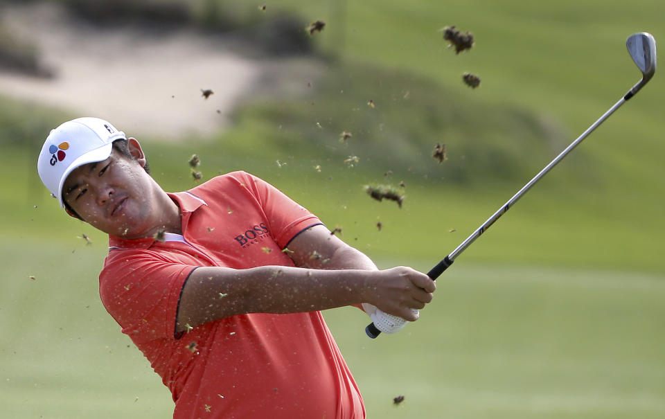 Byeong Hun An of South Korea plays from the first fairway during the Australian Open Golf tournament in Sydney, Thursday, Nov. 15, 2018. (AP Photo/Rick Rycroft)