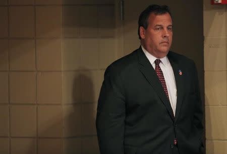 Republican U.S. presidential candidate and New Jersey Governor Chris Christie waits offstage for his turn to speak during the Voters First Presidential Forum in Manchester, New Hampshire August 3, 2015. REUTERS/Brian Snyder