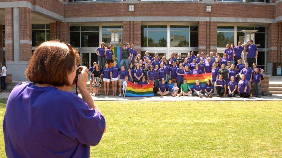 Joy Magnon, office manger of the UNF Women's Center in this March 2009 photo, takes a group photo of the third annual LGBT Awareness Days celebration, "Gay? Fine By Me." The celebration was organized by UNF's Lesbian, Gay, Bisexual, Transgender (LGBT) Resource Center.