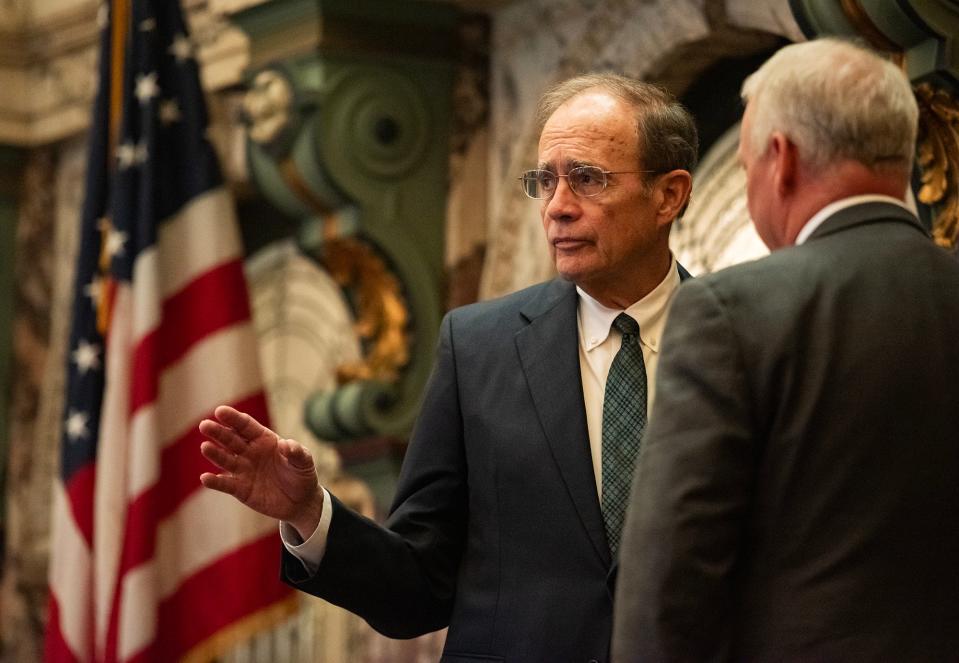 Lt. Gov. Delbert Hosemann speaks to another member of the Senate before calling the session to order at the Mississippi State Capitol in Jackson, Miss., on Monday, Mar. 18, 2024.