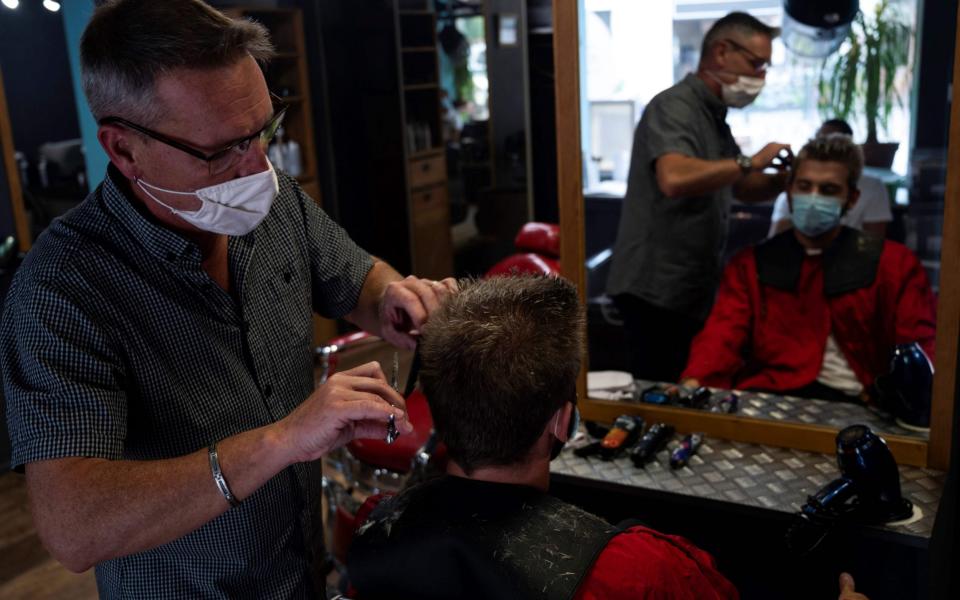 French hairdresser Thierry Gras and founder of the environmentalist and recycling association "Coiffeurs justes" (Fair hairdressers)  - CHRISTOPHE SIMON/AFP