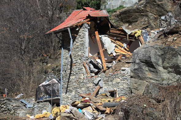 A picture taken on February 23, 2014 in Isola Village (French Alps), shows the site of the mountain cottage destroyed by a rockslide which killed two children aged seven and ten. Both children and their families from the region, arrived yesterday in the village where they occupied an old barn located on a cliff.AFP PHOTO / JEAN CHRISTOPHE MAGNENET        (Photo credit should read JEAN CHRISTOPHE MAGNENET/AFP/Getty Images)