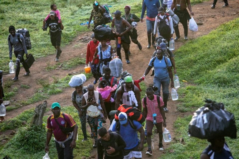 Migrants, most from Haiti, trek through the infamous Darien Gap on their journey toward the United States on October 05, 2021, near Acandi, Colombia. (Photo by John Moore/Getty Images)