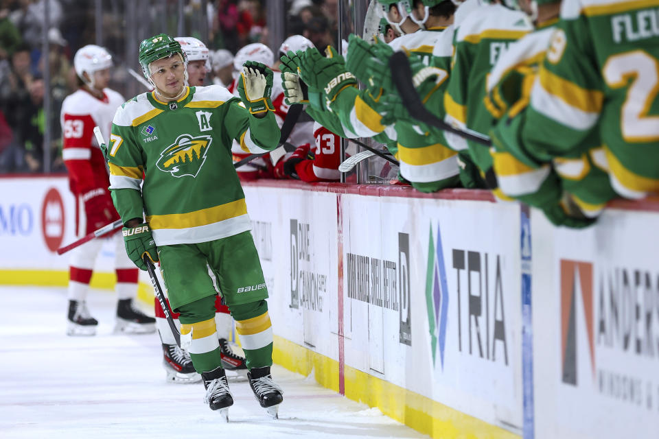 Minnesota Wild left wing Kirill Kaprizov (97) is congratulated for his goal against the Detroit Red Wings during the third period of an NHL hockey game Wednesday, Dec. 27, 2023, in St. Paul, Minn. (AP Photo/Matt Krohn)