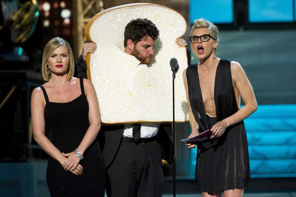 In this April 28, 2012 photo, cast members from the ABC comedy "Happy Endings," Elisha Cuthbert, left, Adam Pally and Eliza Coupe, right, appear onstage at The 2012 Comedy Awards in New York. The Comedy Awards will air on Sunday, May 6 at 9:00 p.m. EST on Comedy Central. (AP Photo/Charles Sykes)