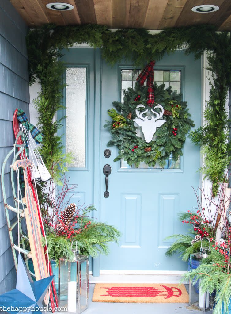 green wreath with wooden deer in the middle (The Happy Housie)