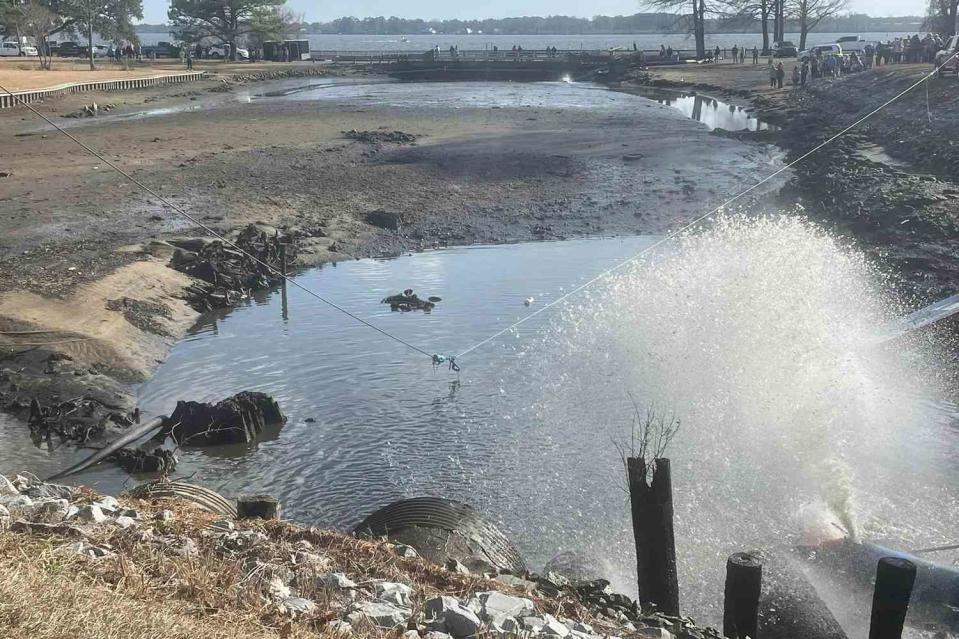 <p>City of Washington/Facebook</p> Crowd watches as crews search for submerged vehicle