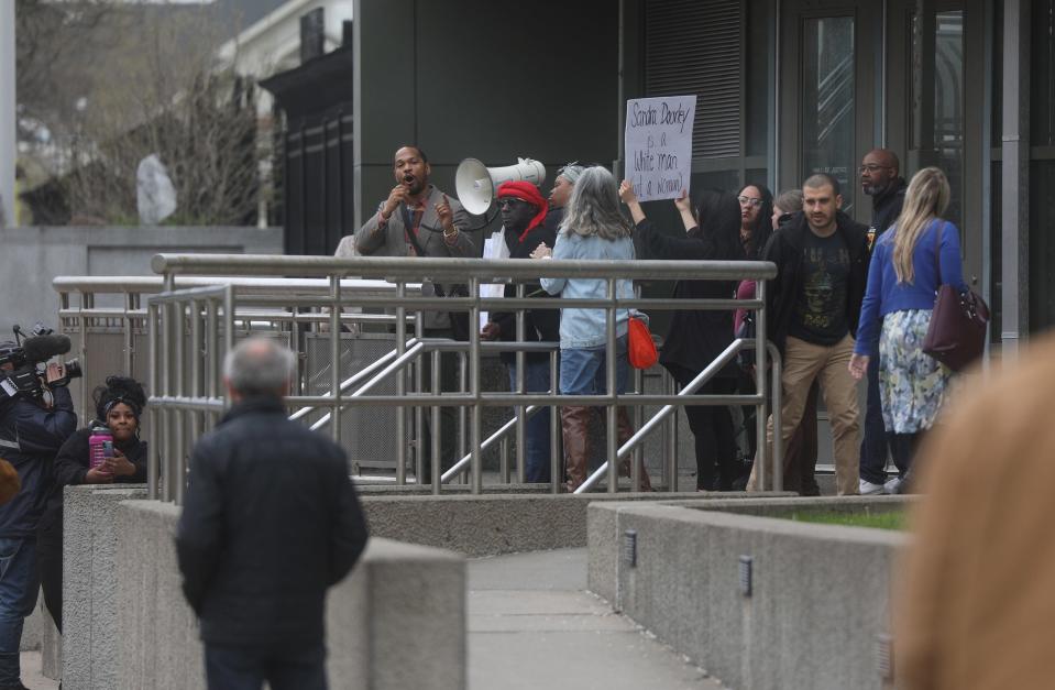 A small group of people protested outside the Monroe County District Attorney’s Office and the Hall of Justice, calling on the resignation of District Attorney Sandra Doorley. Craig Carson protests outside the Hall of Justice.