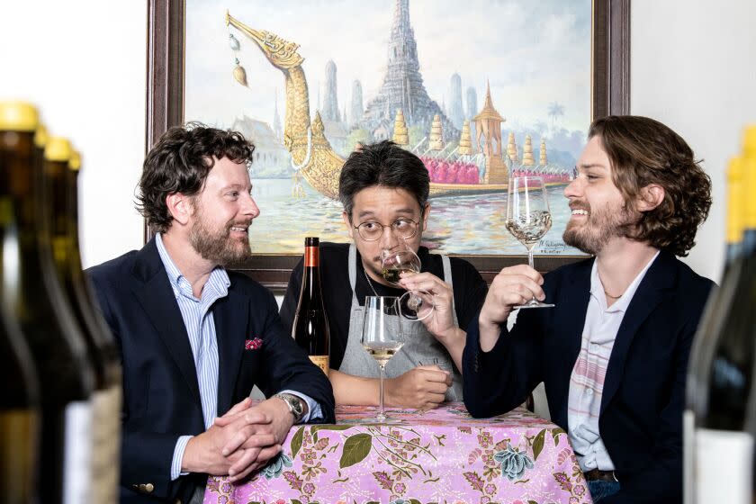 SHERMAN OAKS , CA - MAY 18: Anajak chef and co-owner Justin Pichetrungsi, center, John Cerasulo, left and wine director Ian Krupp at at Anajak Thai on Thursday, May 18, 2023 in Sherman Oaks , CA. (Mariah Tauger / Los Angeles Times)