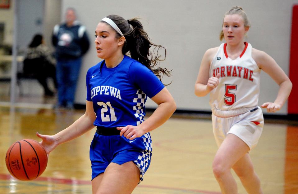 Chippewa's Annabel Rodriguez brings the ball up court with Norwayne's Anna Metzger in pursuit.
