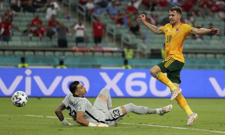 Aaron Ramsey dispatches the ball for Wales to score the first goal of their 2-0 victory against Turkey in Baku