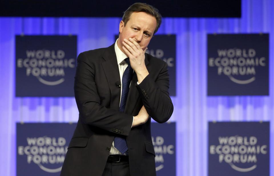 Britain's Prime Minister David Cameron speaks during a session at the annual meeting of the World Economic Forum (WEF) in Davos January 24, 2014. Cameron told the World Economic Forum in Davos on Friday he was confident he could renegotiate his country's relations with the European Union to allow it to remain in the 28-nation bloc. "I'm confident that we'll have a successful renegotiation and a successful referendum," he told delegates, referring to his plan to reshape his country's EU ties before offering Britons an in/out referendum if he is re-elected next year. REUTERS/Ruben Sprich (SWITZERLAND - Tags: POLITICS BUSINESS TPX IMAGES OF THE DAY)