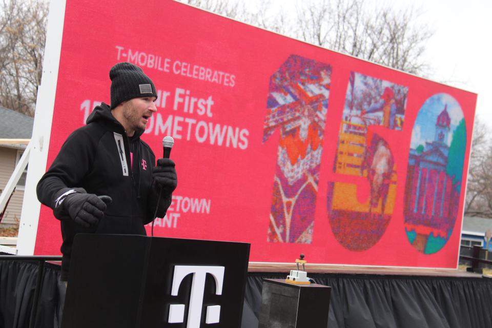 T-Mobile Territory Manager Gary Meier speaks before the 25-foot Lite Brite display was lit on Saturday, Dec. 10, 2022, in Adel.