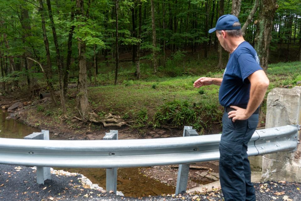 Upper Makefield Fire Chief Tim Brewer shows where last month’s fatal flooding took place along Washington Crossing Road on Monday, Aug. 14, 2023.