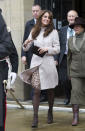 <p>For a trip to Cambridge, Kate donned a beige belted coat by Max Mara with a printed dress underneath. She accessorised with brown suede ankle boots by favourite label, Aquatalia. </p><p><i>[Photo: PA]</i></p>