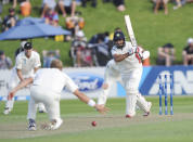 India’s Cheteshwar Pujara bats the ball pats New Zealand’s Neil Wagner on the first day of the second cricket test in Wellington, New Zealand, Friday, Feb. 14, 2014.