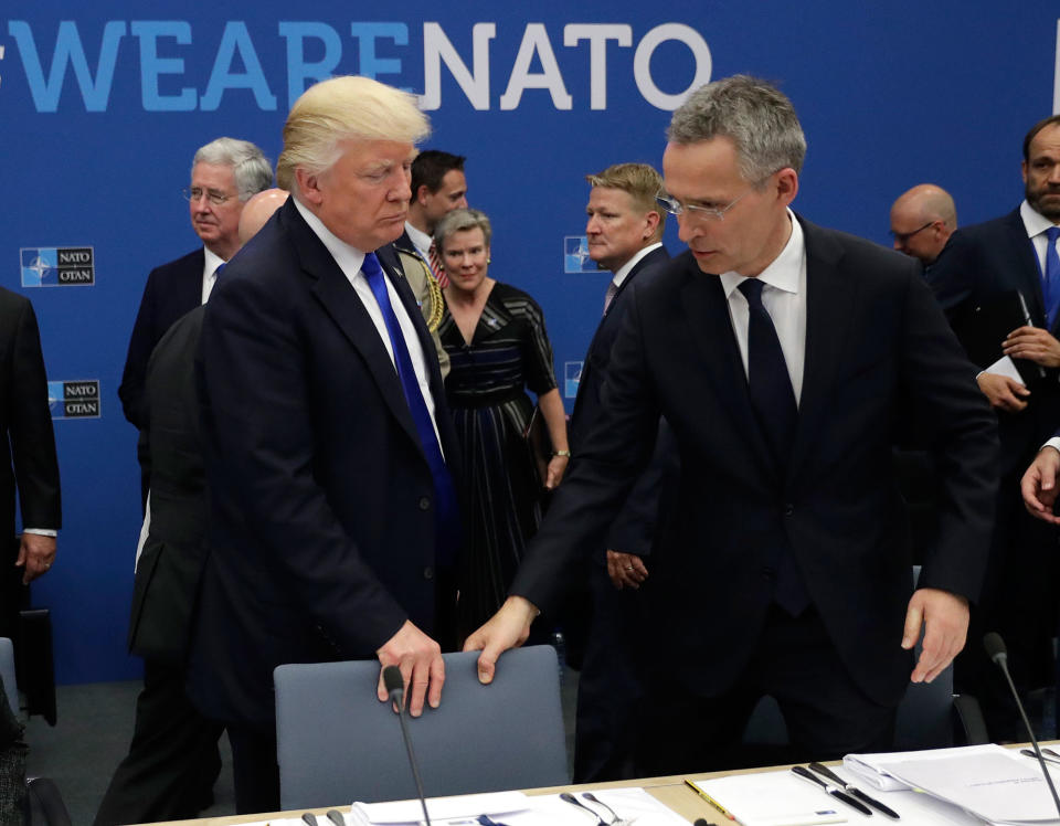 <p>NATO Secretary General Jens Stoltenberg (R) and US President Donald Trump take a seat during a working dinner meeting at the NATO (North Atlantic Treaty Organization) headquarters in Brussels on May 25, 2017 during a NATO summit. (Matt Dunham/AFP/Getty Images) </p>