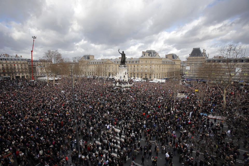 A crowd gather in Republique square before the demonstration, in Paris, France, Sunday, Jan. 11, 2015.  (AP Photo/Laurent Cipriani)