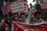 Members of Communist Party of India shout slogans during a protest against farm laws in Mumbai, India Monday, Sept. 27, 2021. The farmers called for a nation-wide strike Monday to mark one year since the legislation was passed, marking a return to protests that began over a year ago. (AP Photo/Rafiq Maqbool)