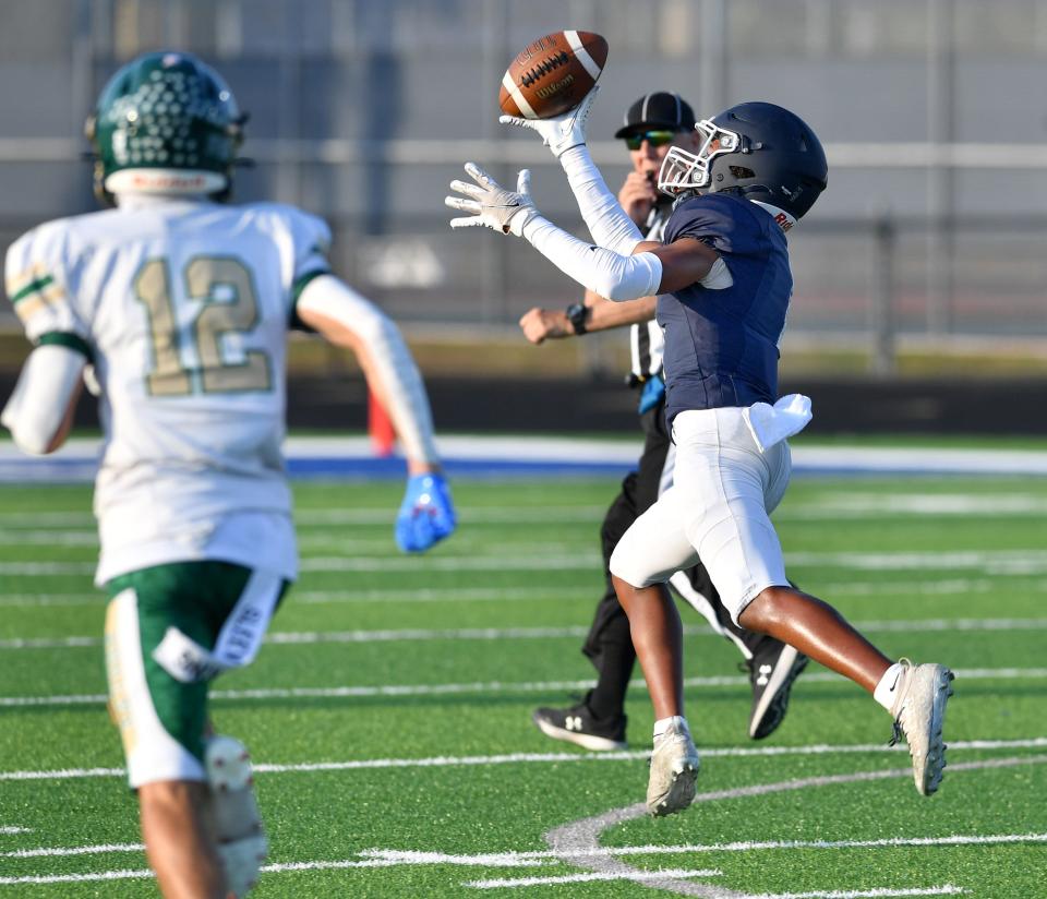 North Port wide receiver Makai Bernard (#1) pulls in a pass with one hand and takes it for a 78-yard touchdown on the Bobcat's first offensive play. The North Port Bobcats hosted the Island Coast Gators in a spring football game Friday, May 24, 2024.
