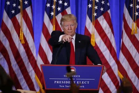 U.S. President-elect Donald Trump calls on a reporter during a news conference in the lobby of Trump Tower in Manhattan, New York City, U.S., January 11, 2017. REUTERS/Lucas Jackson