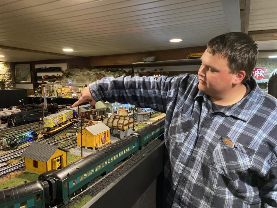 Tristan Mundis indicates an iconic York County brand, Bickel’s, that is incorporated into the model train set in the basement of his West Broadway, Red Lion, home.