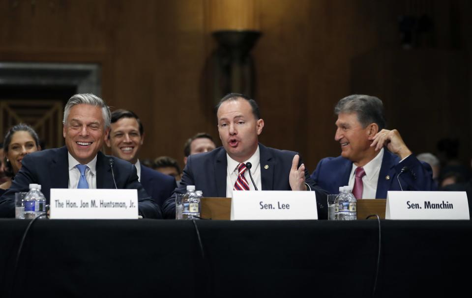Former Utah Gov. Jon Huntsman, left, laughs as Sen. Mike Lee, R-Utah, speaks, with Sen. Joe Manchin, D-W.Va., right, during a hearing of the Senate Foreign Relations Committee on his nomination to become the U.S. ambassador to Russia, on Capitol Hill on Sept. 19, 2017. | Alex Brandon, Associated Press