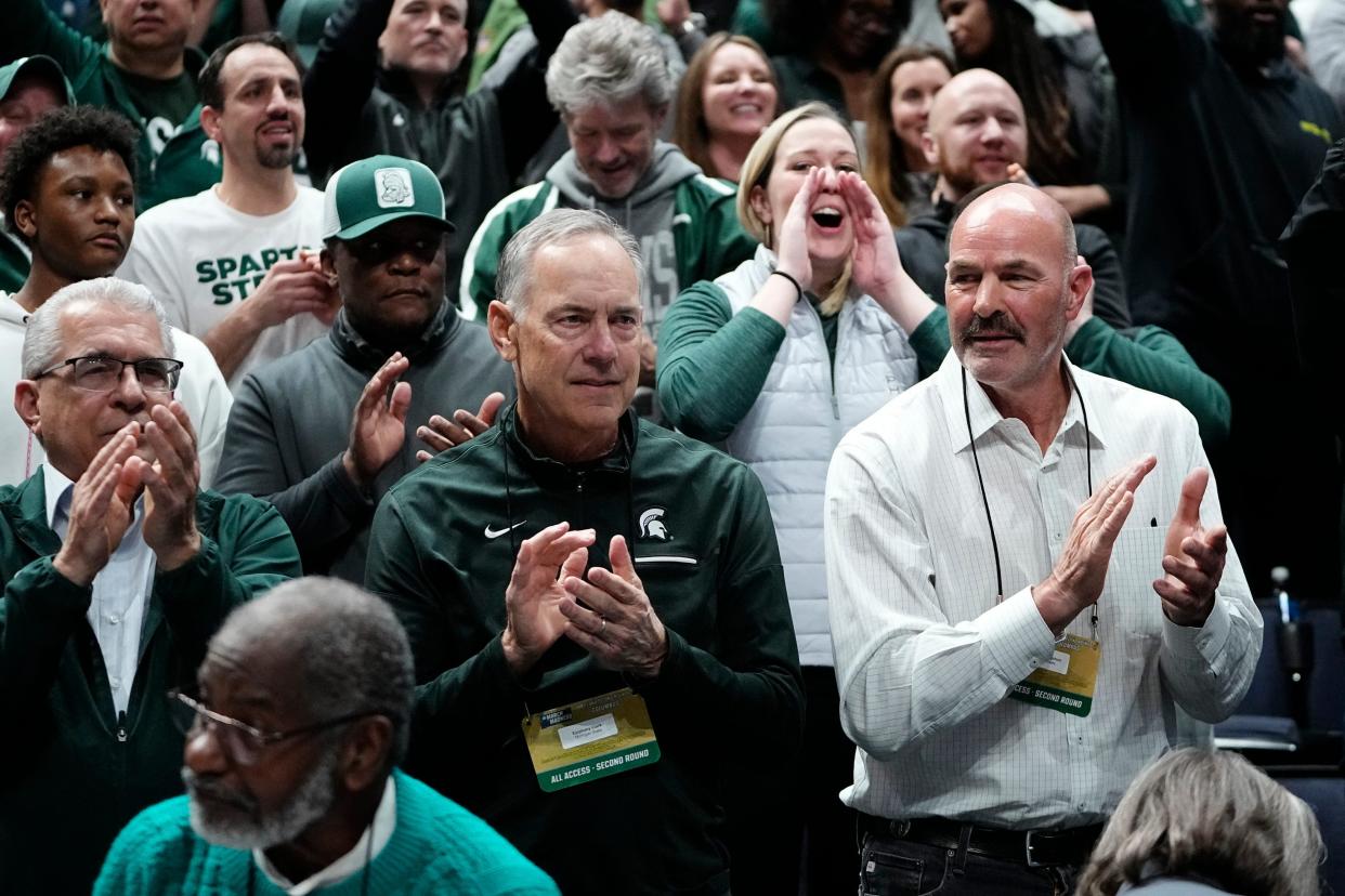 NFL Hall of Famer and Detroit Lions legend Barry Sanders claps while watching Michigan State play Marquette in the second-round NCAA tournament game Sunday, in Columbus, Ohio. Sanders' son, Nick, is a freshman on the Spartan basketball team.