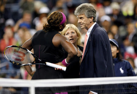 FILE PHOTO: Serena Williams of the U.S. talks with tournament referee Brian Earley and an official as a line judge (R) stands by during the match against Kim Clijsters of Belgium at the U.S. Open tennis tournament in New York, U.S. REUTERS/Kevin Lamarque/File Photos