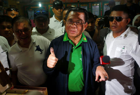 Ebrahim Murad, Chairman of the Moro Islamic Liberation Front (MILF), gestures after casting his vote during the plebiscite on Bangsamoro Organic Law (BOL) at a voting precinct in Sultan Kudarat, Maguindanao province, Philippines January 21, 2019. REUTERS/Marconi B. Navales