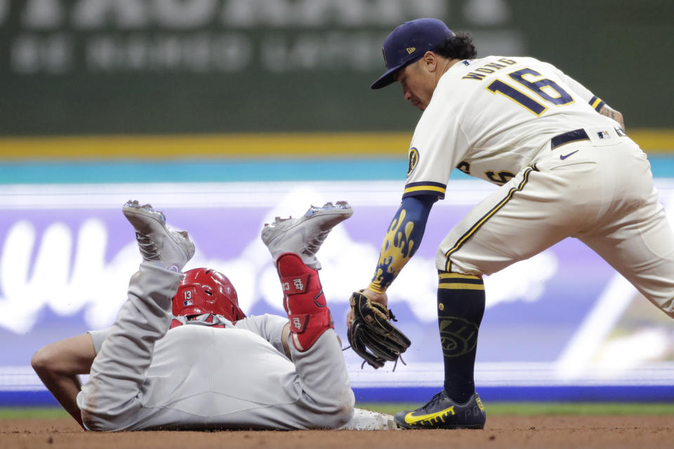 St. Louis Cardinals' Matt Carpenter, left, slides safely into second base for a double past the tag of Milwaukee Brewers' Kolten Wong (16) during the seventh inning of a baseball game Monday, Sept. 20, 2021, in Milwaukee. (AP Photo/Aaron Gash)