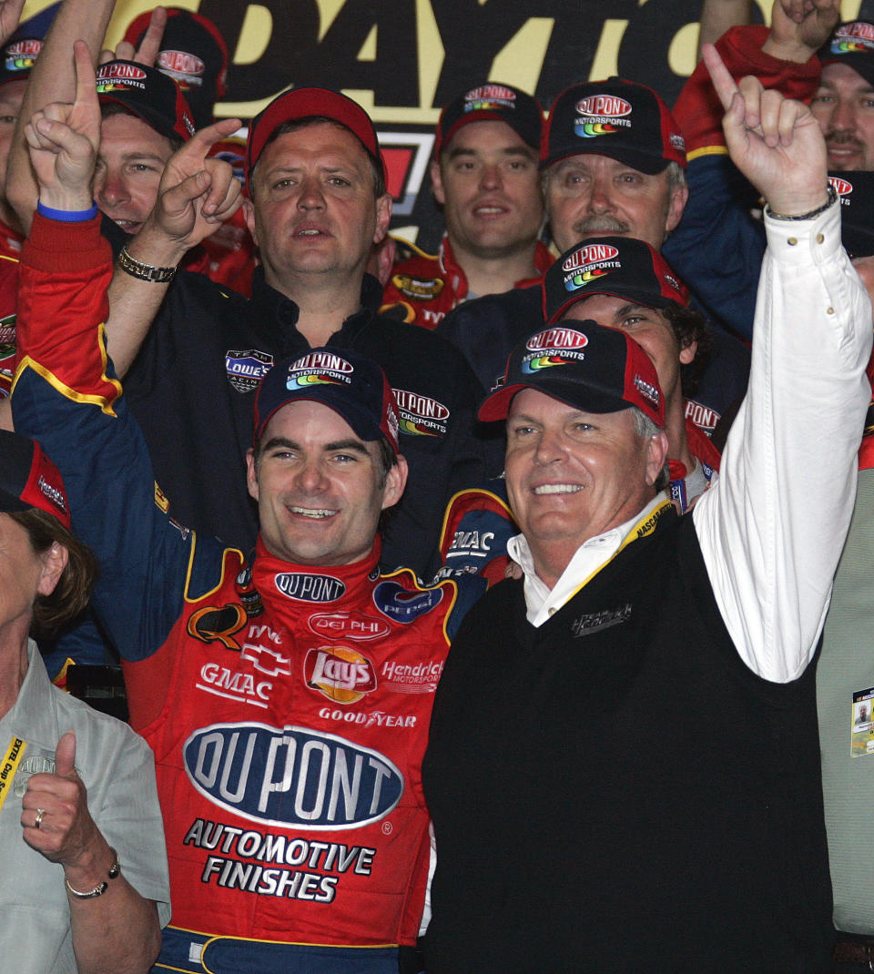 FILE - NASCAR driver Jeff Gordon, left, celebrates his victory in the Daytona 500 with car owner Rick Hendrick in Victory Lane of the Daytona International Speedway in Daytona Beach, Fla., in this Sunday, Feb. 20, 2005, file photo. Jeff Gordon will leave the Fox Sports booth for a daily role at Hendrick Motorsports as vice chairman ranked second only to majority owner Rick Hendrick. The new job positions the four-time champion and Hall of Famer to eventually succeed Hendrick at the top of NASCAR’s winningest organization. (AP Photo/Terry Renna, File)