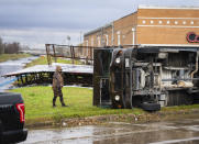 A UPS truck is overturned where a tornado was reported to pass along Fairmont Parkway, Tuesday, Jan. 24, 2023, in Pasadena, Texas. (Mark Mulligan/Houston Chronicle via AP)