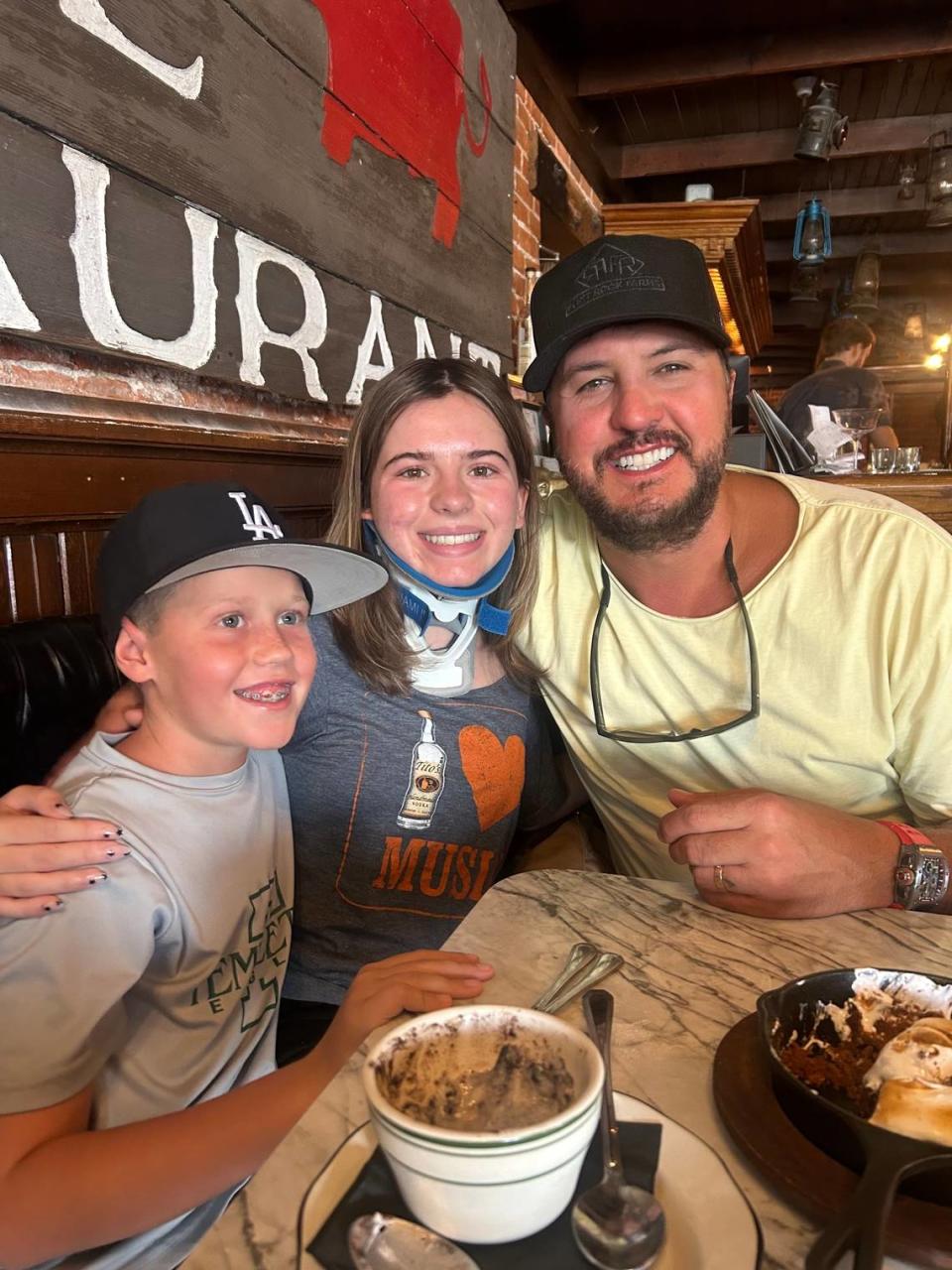 Country singer Luke Bryan with Addyson Nixon and her brother Parker Nixon at the Pig Iron restaurant in Templeton on July 23, 2023.