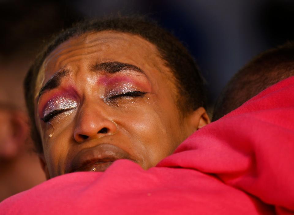 Leia-jhene Seals was performing at Club Q Saturday night when a 22-year-old gunman entered the LGBTQ nightclub, killing five people and injuring at least 25 others. Seals hugs R.J. Lewis at a vigil at All Souls Unitarian Church on November 20, 2022, in Colorado Springs, Colorado. Lewis was also at the nightclub.