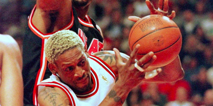 Chicago Bulls' Dennis Rodman grabs a rebound in front of Miami Heat's Alonzo Mourning during an NBA Eastern Conference Finals game in May 22, 1997.