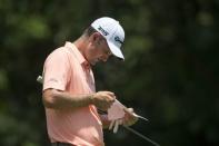 May 26, 2018; Fort Worth, TX, USA; Justin Rose checks his scorecard on the fifth green during the third round of the Fort Worth Invitational golf tournament at Colonial Country Club. Mandatory Credit: Jerome Miron-USA TODAY Sports