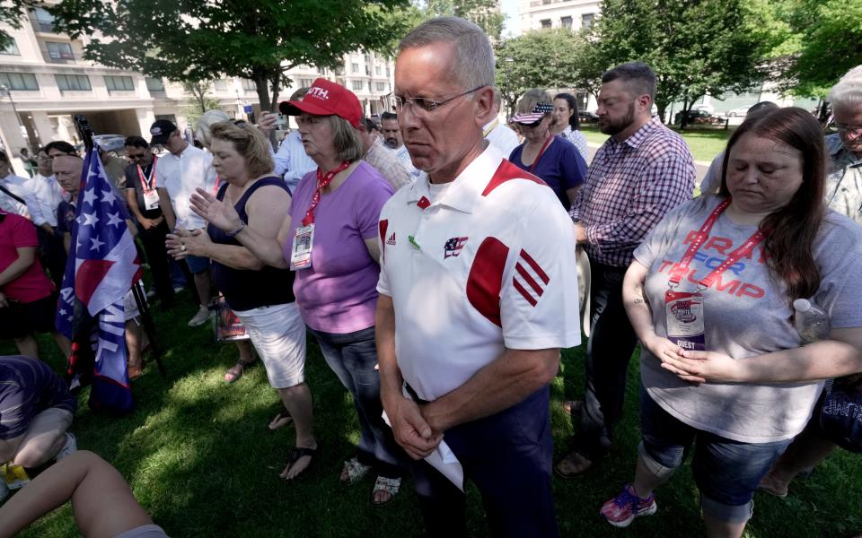 Wisconsin State Rep. Chuck Wichgers (R-Muskego) bows his head during a Prayer Vigil for America Sunday, July 14, 2024 at Zeidler Union Square in Milwaukee, Wisconsin. The park is located five blocks from Fiserv Forum, site of the Republican National Convention that starts Monday.