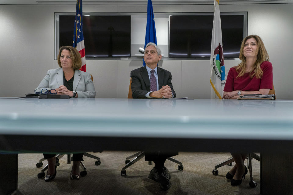 Attorney General Merrick Garland, center, Deputy Attorney General Lisa Monaco, left, and Drug Enforcement Administration Administrator Anne Milgram participate in a press event to announce the results of an enforcement surge to reduce the fentanyl supply across the United States, at DEA headquarters, Arlington, Va., Tuesday, Sept. 27, 2022. (AP Photo/Gemunu Amarasinghe)