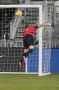 El Salvador goalkeeper Henry Hernandez is unable to stop a shot by U.S. midfielder Sebastian Lletget for a goal during the first half of an international friendly soccer match Wednesday, Dec. 9, 2020, in Fort Lauderdale, Fla. (AP Photo/Wilfredo Lee)