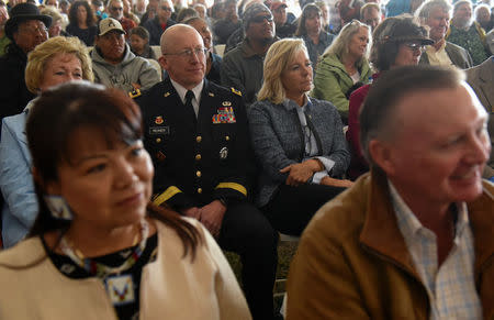 People listen to Harold Frazier (not pictured), chairman of the Cheyenne River Reservation, speak at the Honoring the Spirit event at Fort Laramie National Historic Site in Wyoming, U.S., April 28, 2018. REUTERS/Stephanie Keith
