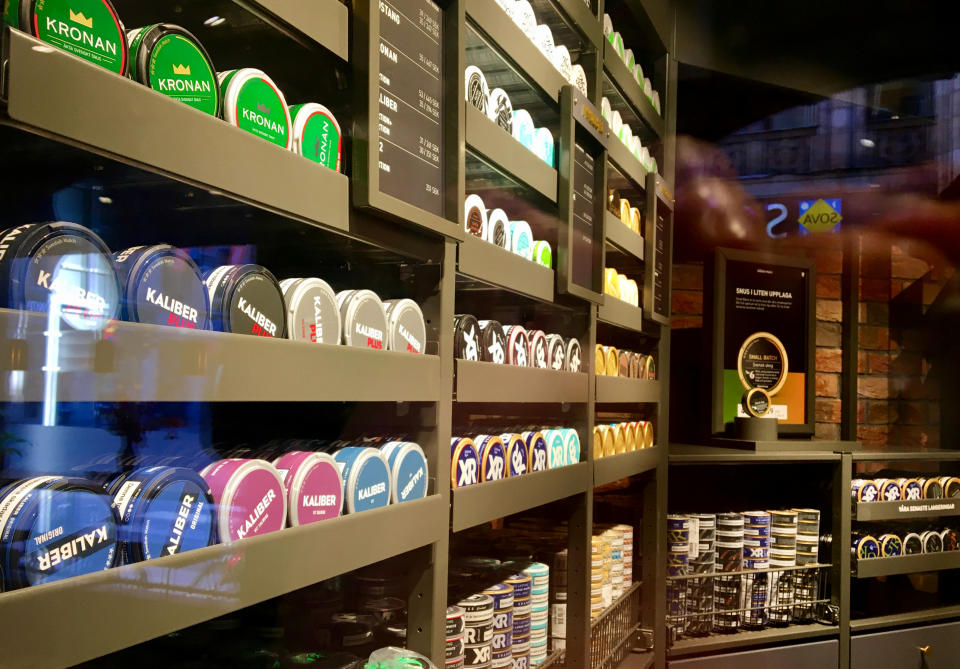 Moist powder tobacco “snus” cans are seen on shelves at a Swedish Match store in Stockholm, Sweden, on 24 October, 2018. (PHOTO: Reuters)