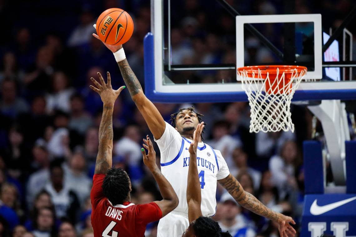 Kentucky’s Daimion Collins (4) blocks a shot by Arkansas’ Davonte Davis (4) during Tuesday’s game at Rupp Arena. Collins finished with seven points in eight minutes of action.