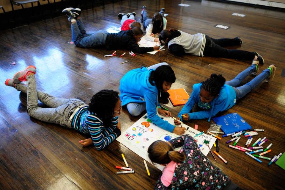 FILE - Students create posters during drama class at C.T. Walker Traditional Magnet School. The Richmond County school scored high marks in multiple factors of the most recent version of Georgia's College and Career Ready Performance Index.