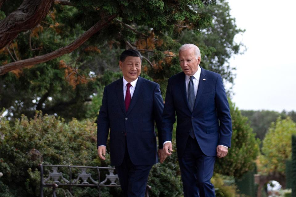 Xi and Biden walk together during the 2023 APEC Summit in San Francisco.